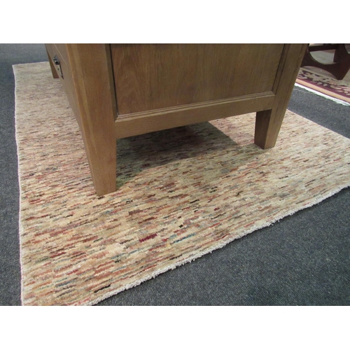 1103 - A modern cream ground rug with multicoloured stripes, 179cm x 116cm  (E)  £10-15