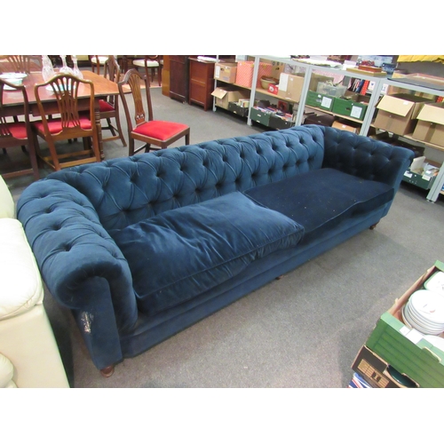 1138 - An Edwardian chesterfield sofa with deep blue velvet upholstery, a/f