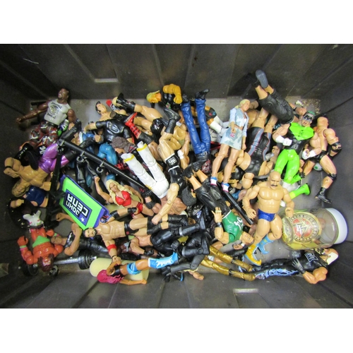 7046 - A collection of mostly WWE wrestling action figures, two wrestling rings and other accessories, toge... 