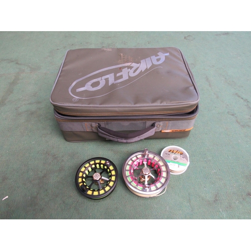 7222 - Two Hardy fly fishing spools in a padded Airflo compartmentalised reel case