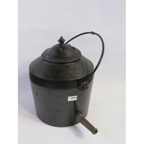 7230 - A cast iron four gallon kettle with hanger and brass spout