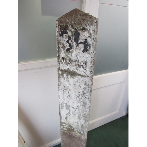 7116 - An M&GN triangular concrete mile post depicting 36 to the front and dated Nov 1921 on the back, 153c... 