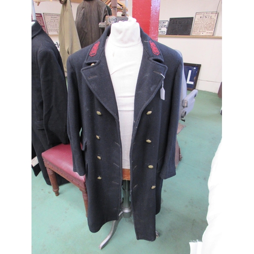 7148 - A GWR double breasted overcoat with matching brass buttons and GWR embroidered in red lapels on the ... 