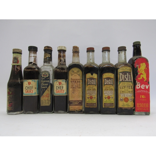 7216 - Nine sauce bottles, some with contents including 'Bev' and 'Distil'