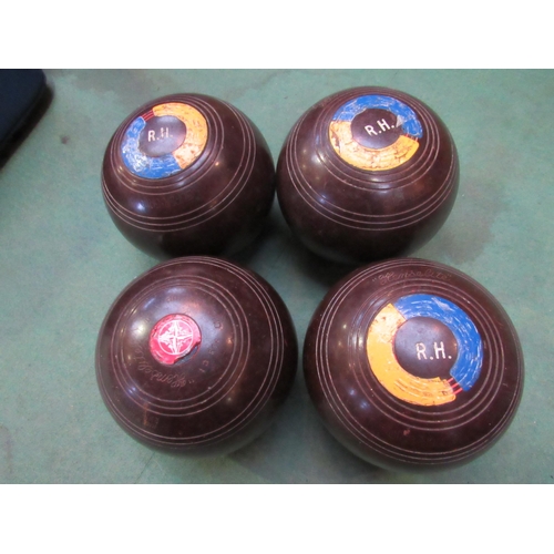 7251 - Four bags of mixed lawn bowls