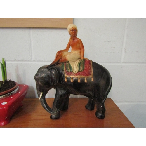 1013 - A circa 1930's plaster elephant figure with rider (restoration to neck) 35cm high   (E)  £10-20