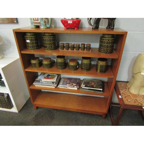 1016 - An open fronted four tier bookcase, 118cm high x 110cm wide x 30cm deep