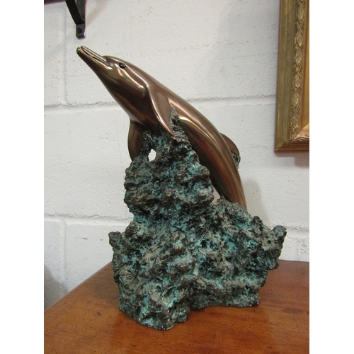 1033 - A Foot's Artworks, Australia 2001 cold cast bronze of a dolphin, 29.5cm high x 24cm wide x 16.5cm de... 