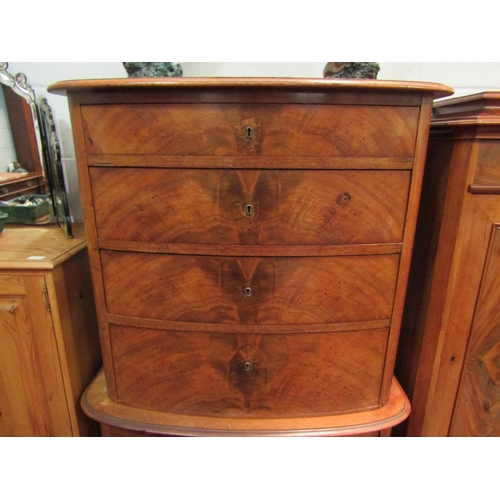 1034 - A 19th Century bow front chest on chest, four graduating drawer top over a three graduating drawer b... 