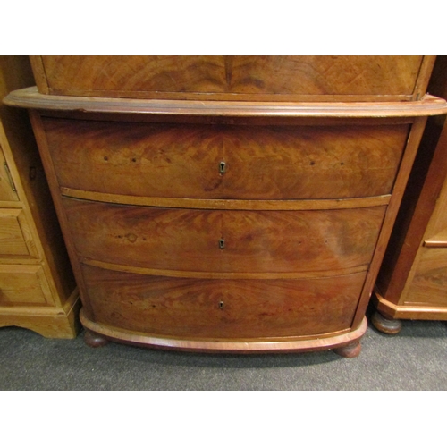 1034 - A 19th Century bow front chest on chest, four graduating drawer top over a three graduating drawer b... 