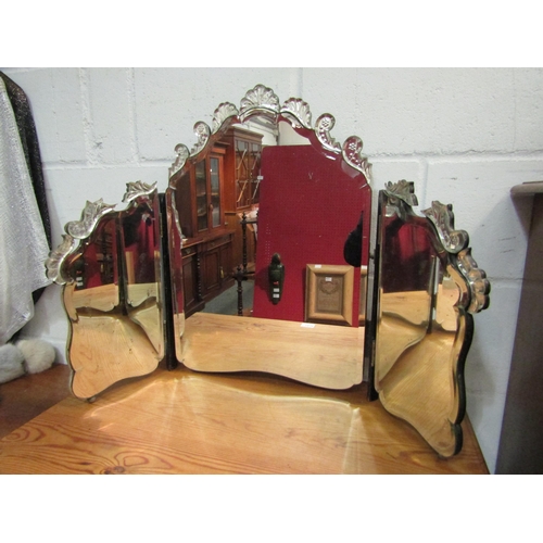 1035 - A vintage Venetian style triptych dressing table mirror with bevelled edge