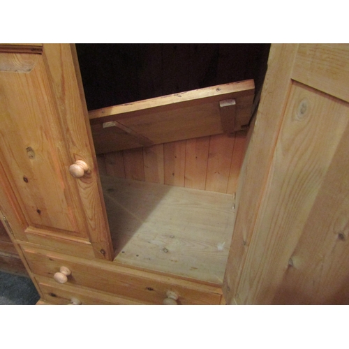 1036 - A country pine cupboard, the two doors over two drawers, 115cm high x 76cm wide x 45cm deep