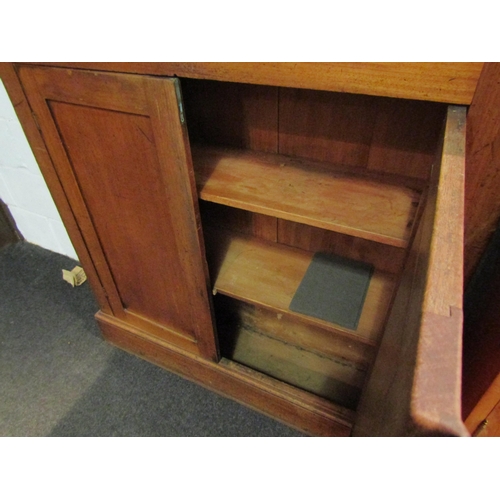 1038 - An early 20th Century mahogany two door cupboard, 107cm high x 106cm wide x 30cm deep