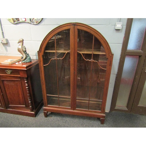 1040 - A 20th Century oak dome top china display cabinet, crack to glass, 140cm high x 94cm wide x 32cm dee... 