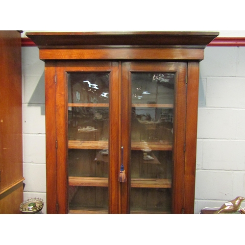 1046 - A Victorian mahogany full height bookcase, glazed top over single drawer and two door cupboard, plin... 