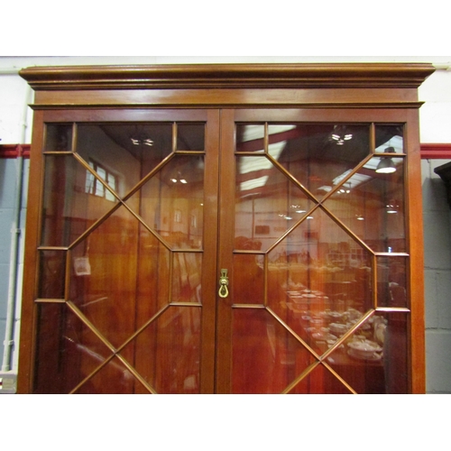 1048 - An early 20th Century mahogany bureau bookcase with fitted pigeon hole and drawer interior, two shor... 