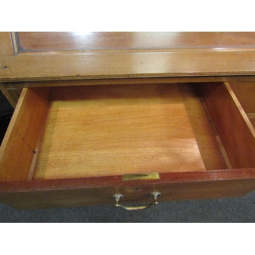 1048 - An early 20th Century mahogany bureau bookcase with fitted pigeon hole and drawer interior, two shor... 