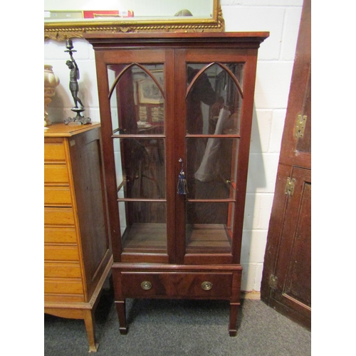 1052 - A Regency style mahogany display cabinet with arched astragal glazed doors, single drawer, square ta... 