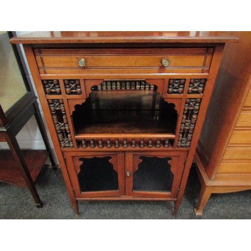 1057 - A Victorian walnut mirror back cabinet with spindle detail and recess over glazed doors, 157cm high ... 