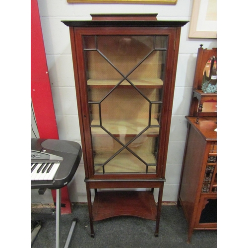 1061 - An Edwardian glazed china display cabinet raised on square legs with under-tier, 160cm high x 59cm w... 