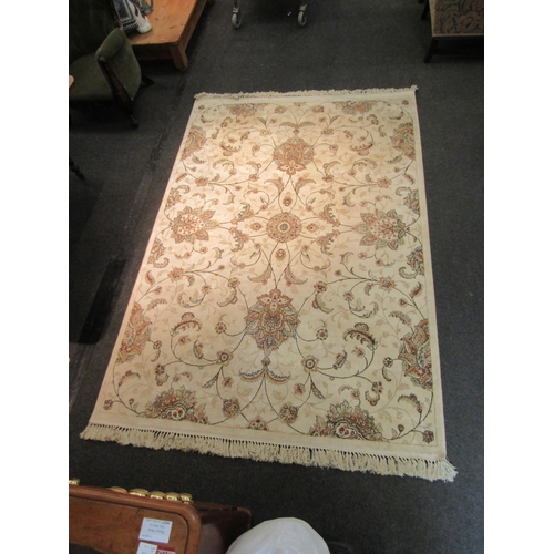 1543 - A cream ground floral pattern silk rug with tasselled ends, 240cm x 161cm   (R)  £80