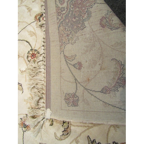 1543 - A cream ground floral pattern silk rug with tasselled ends, 240cm x 161cm   (R)  £80