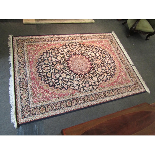 1544 - A blue ground machine woven rug with floral pattern, multiple borders and tasselled ends, 223cm x 16... 