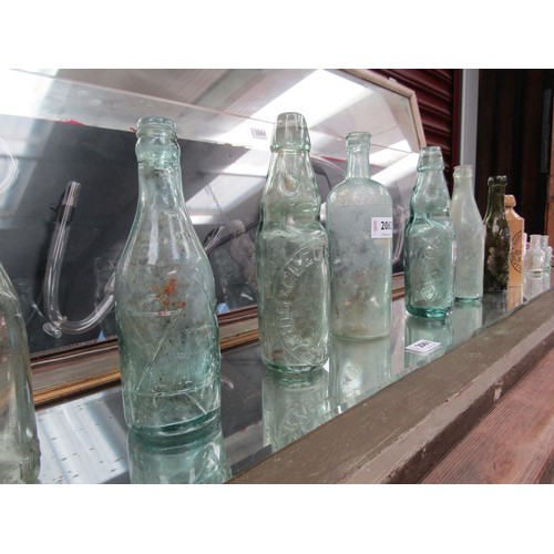 2242 - A quantity of bygone mainly glass and stoneware bottles to include Wheeler & Co, Clegg & Co cod bott... 