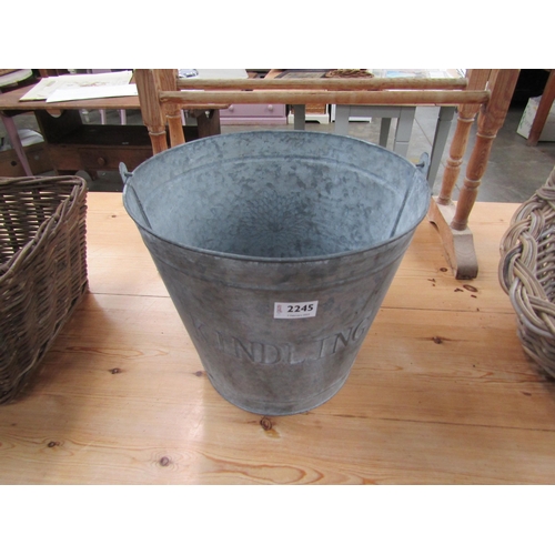 2312 - A galvanized kindling bucket and two tier fruit basket