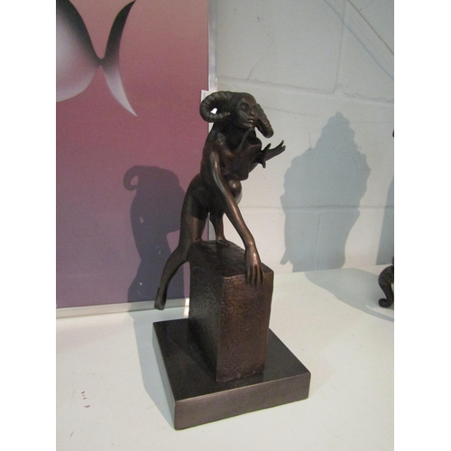 2095 - A bronze devil woman with horns on marble base. 28.5cm high