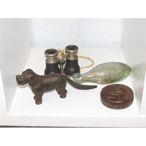 1416 - A cast iron nut cracker in the form of a dog, Talbot & Co. torpedo bottle and a pair of binoculars