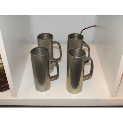 1417 - Four pewter tankards made by Viners designed by Gerald Benny