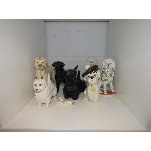 1426 - Eight ceramic dog figures including Beswick   (R)  £25