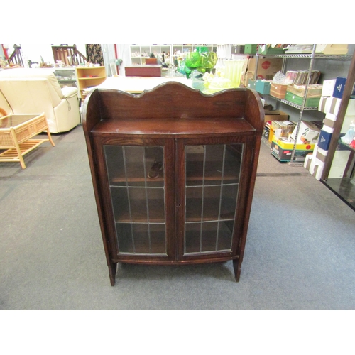 1542 - A 1920s oak cabinet, leaded glazed doors, 108cm high x 75cm wide x 26cm deep