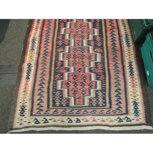 1028 - A cotton kilim runner rug in rust and pink colours, 376cm x 105cm