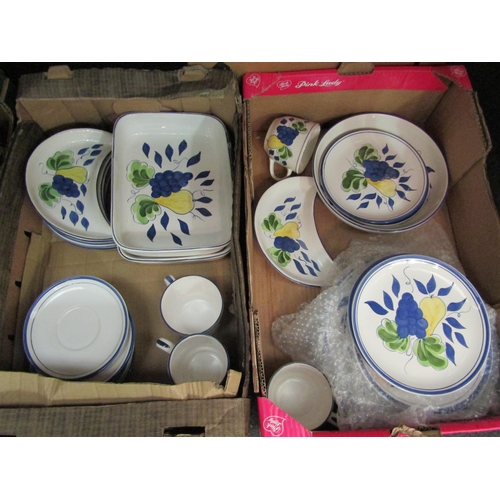 1415 - Four boxes containing a quantity of modern decorative dinner and tea wares decorated with grapes and... 