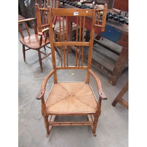 2008 - An early 19th Century Country oak rocking armchair with faux bamboo supports   (R) £140