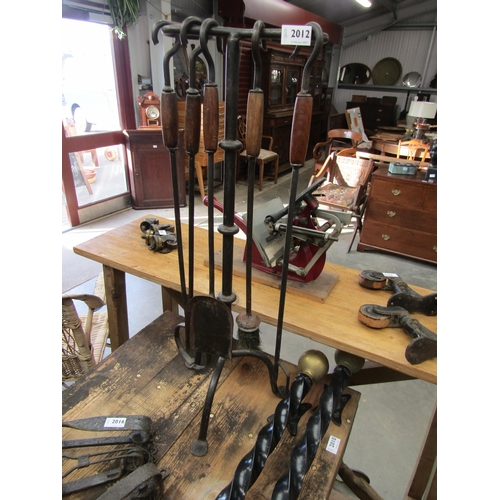 2012 - A blacksmith's made fireside companion set    (R) £50