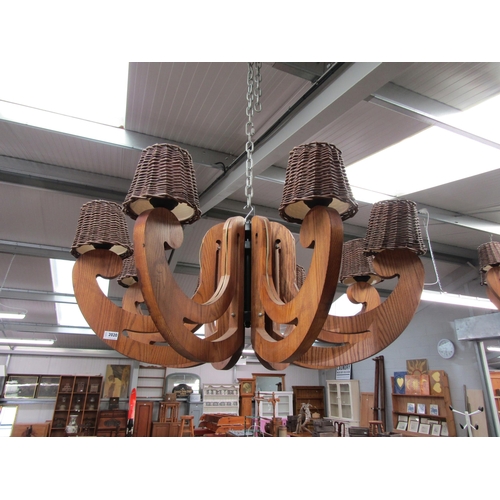 2020 - A substantial wooden 8 arm electrolier with wicker shades   (R) £60