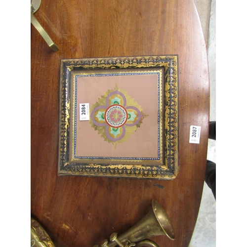 2084 - A Victorian ebonised and gilt kettle stand with glass top