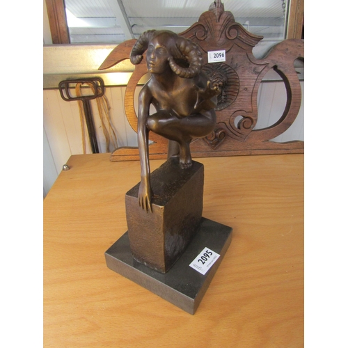 2095 - A bronze devil woman with horns on marble base. 28.5cm high