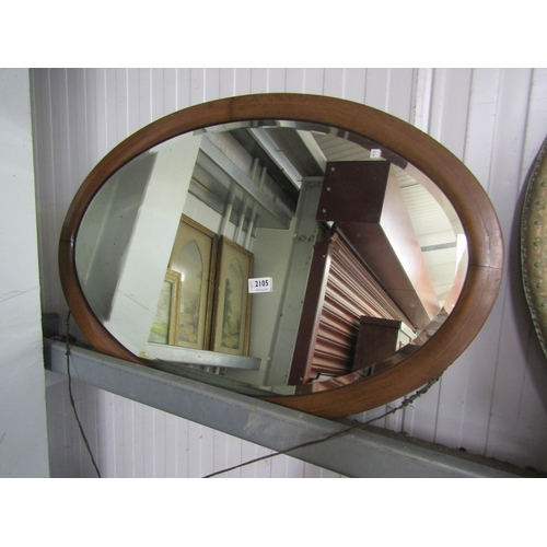 2105 - An oval wall mirror