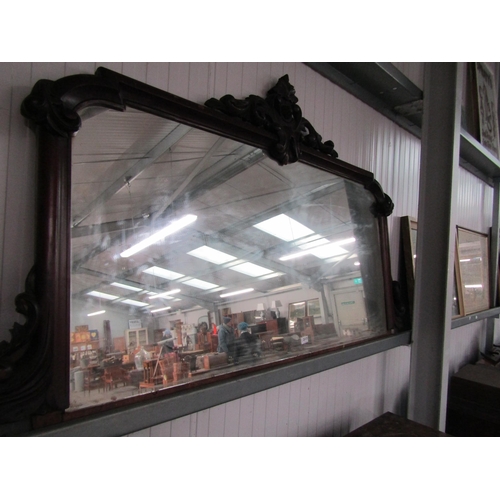 2113 - A large Victorian mahogany framed over mantel mirror with carved crest to top