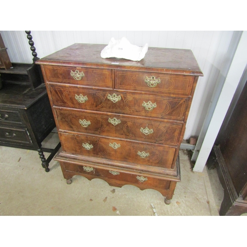 2114 - A Queen Ann walnut two over three graduating chest on single drawer stand