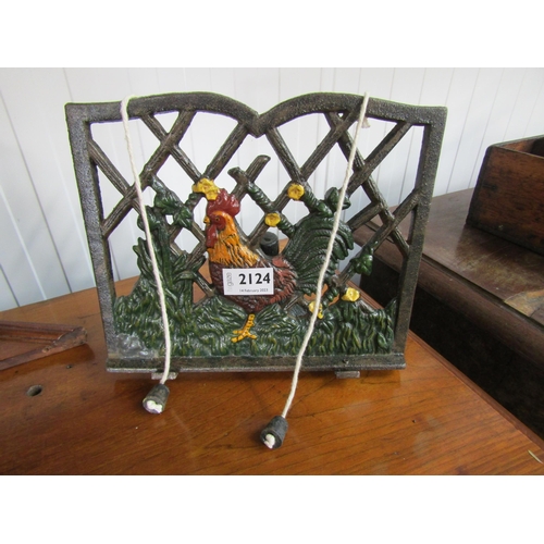 2124 - A cast iron book stand with cockerel design