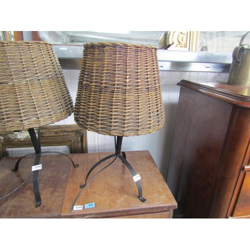 2144 - A wrought iron and wicker table lamp