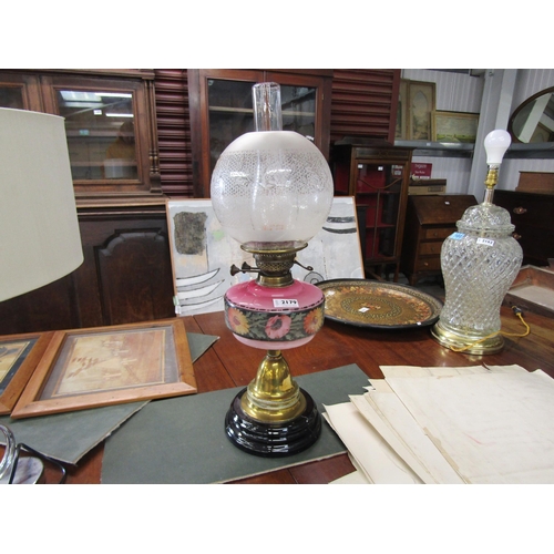 2179 - A Victorian brass and hand painted glass oil lamp (chip to shade)