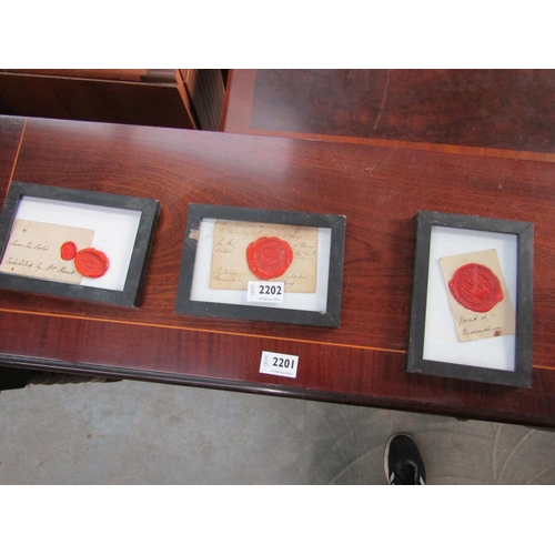 2202 - Three wax seels, framed