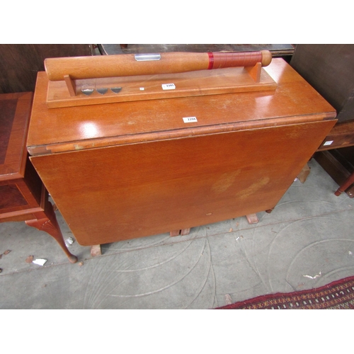 2206 - An oak drop leaf table cupboard