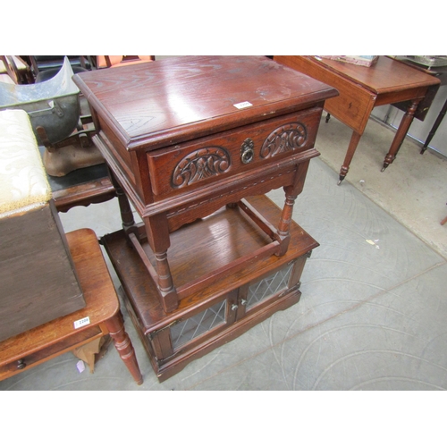 2209 - An oak lead glazed TV stand and bedside table